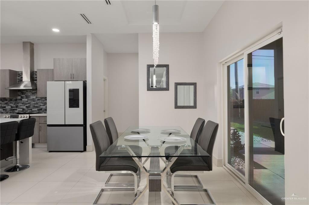 801 East Azucar Avenue Pharr, TX 78577 - Photo 6 of 19 Dining space featuring light tile patterned floors and visible vents