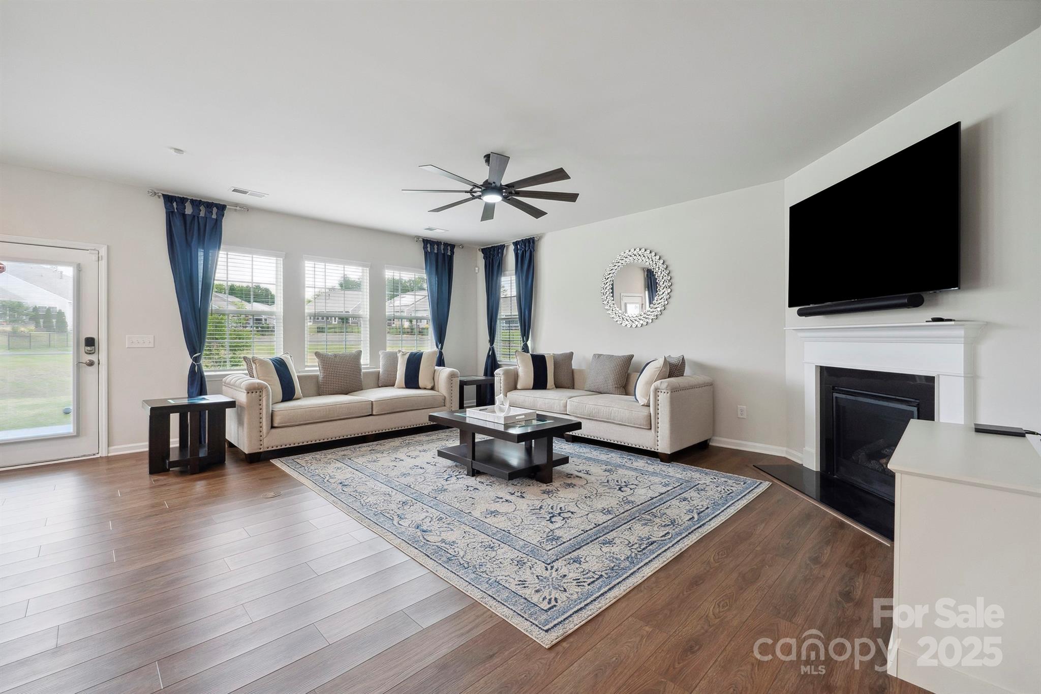4015 Havenport Circle Fort Mill, SC 29708 - Photo 14 of 47 a living room with furniture and a flat screen tv