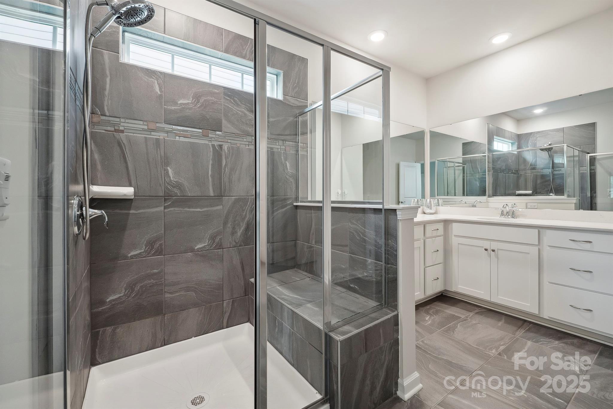 4015 Havenport Circle Fort Mill, SC 29708 - Photo 21 of 47 a bathroom with a shower sink and mirror