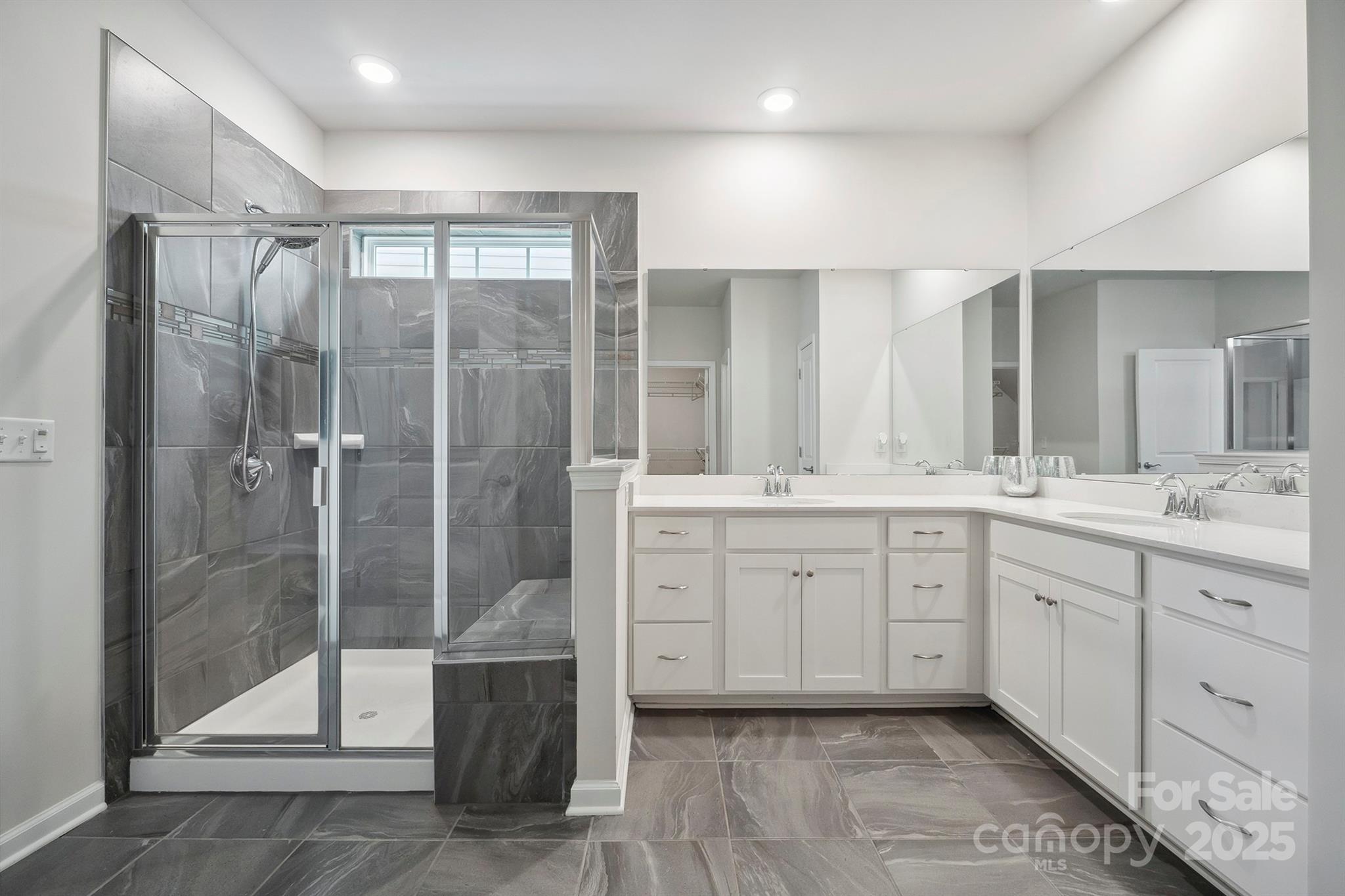 4015 Havenport Circle Fort Mill, SC 29708 - Photo 22 of 47 a spacious bathroom with a shower sink and mirror