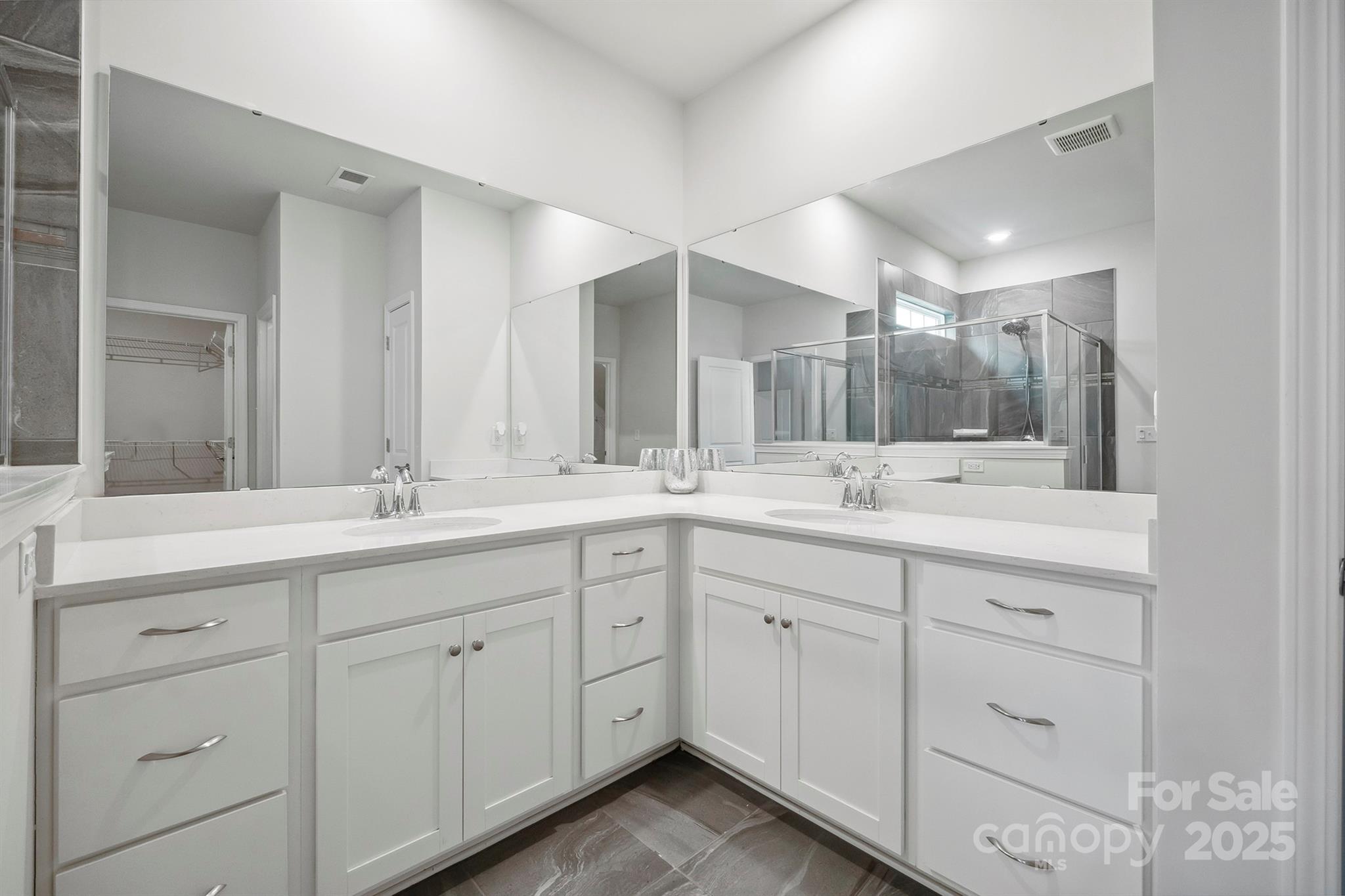4015 Havenport Circle Fort Mill, SC 29708 - Photo 23 of 47 a bathroom with double sink and a mirror