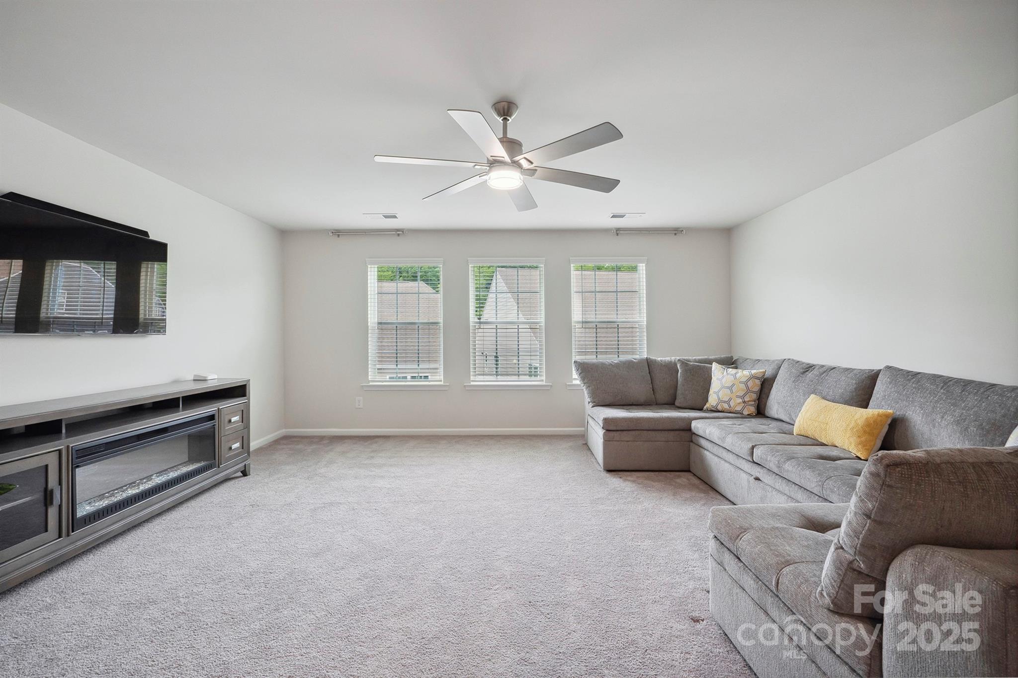 4015 Havenport Circle Fort Mill, SC 29708 - Photo 29 of 47 a living room with furniture and a flat screen tv