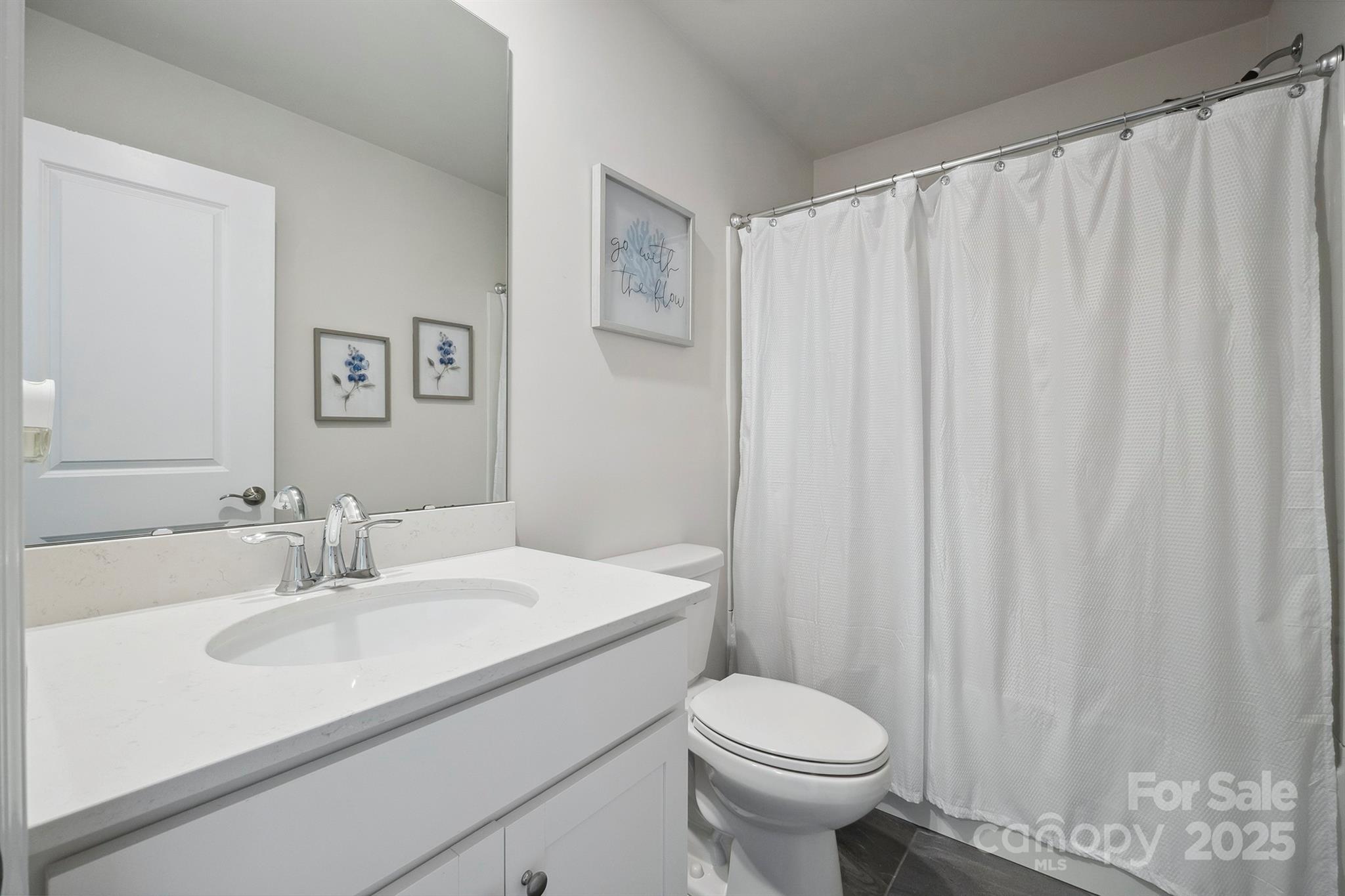 4015 Havenport Circle Fort Mill, SC 29708 - Photo 32 of 47 a bathroom with a sink a toilet and shower curtain