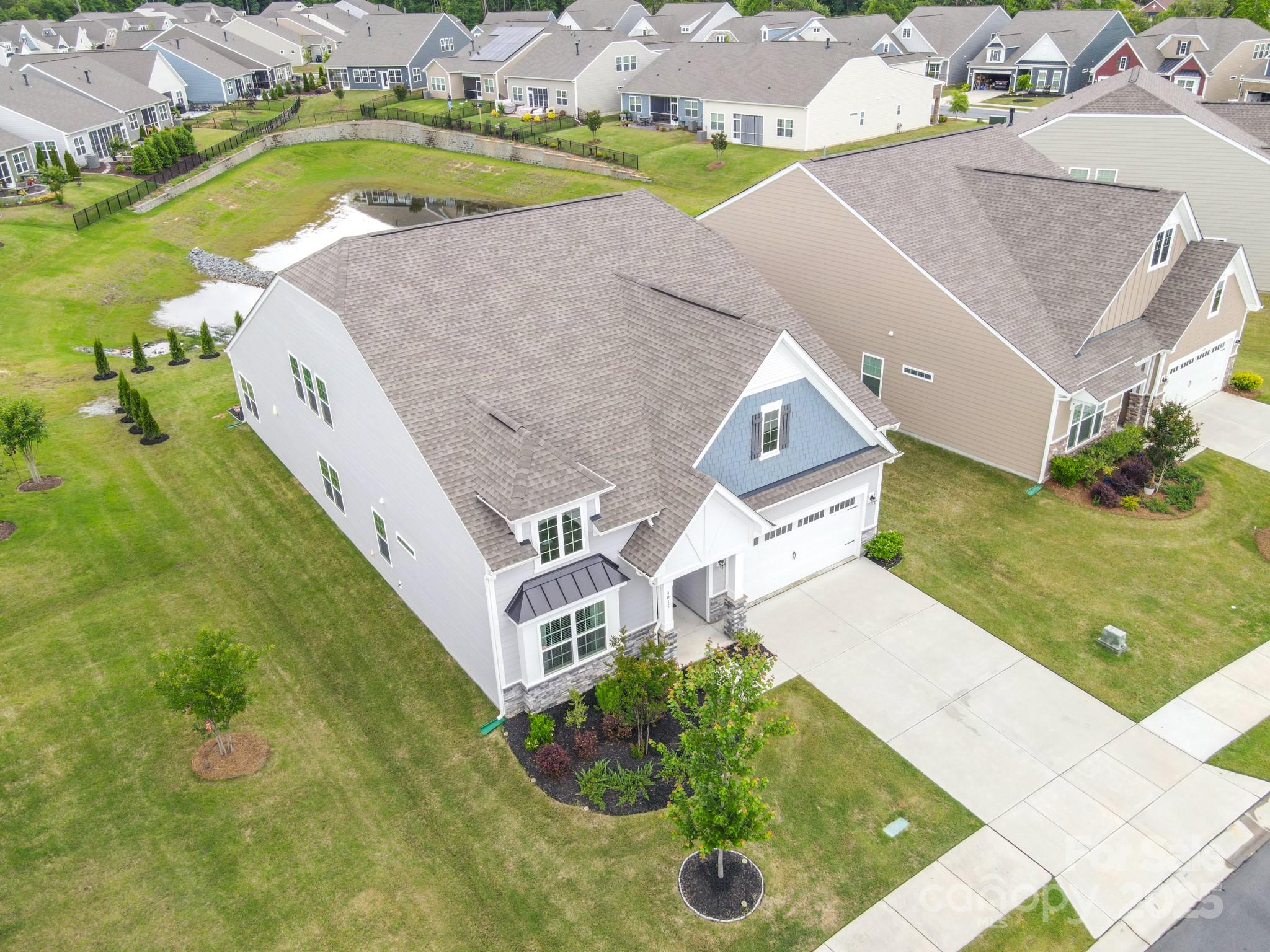4015 Havenport Circle Fort Mill, SC 29708 - Photo 39 of 47 an aerial view of a house with a garden and swimming pool