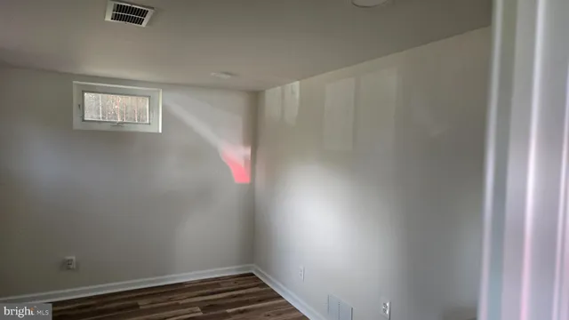 a room that has a window and a closet area