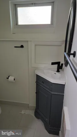 a bathroom with a sink a vanity and mirror