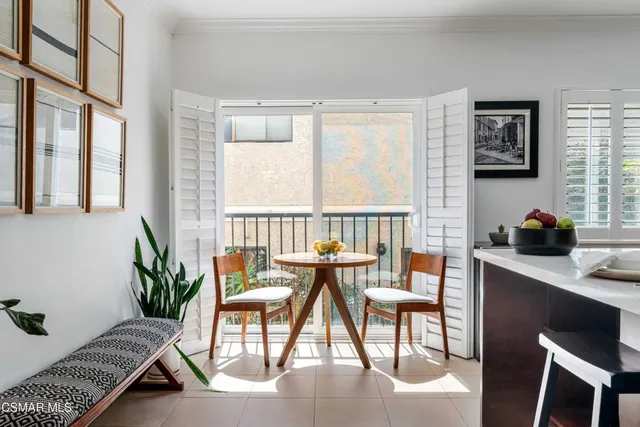 a view of a livingroom with furniture and a potted plant