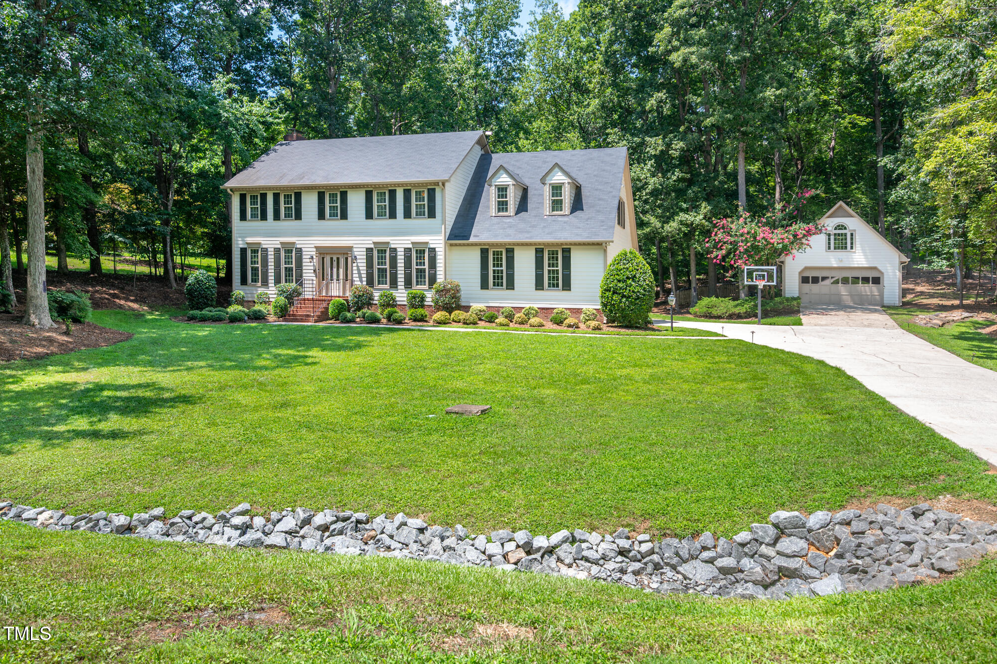 5611 Red Coach Road Durham, NC 27712 - Photo 1 of 51 a front view of a house with a garden
