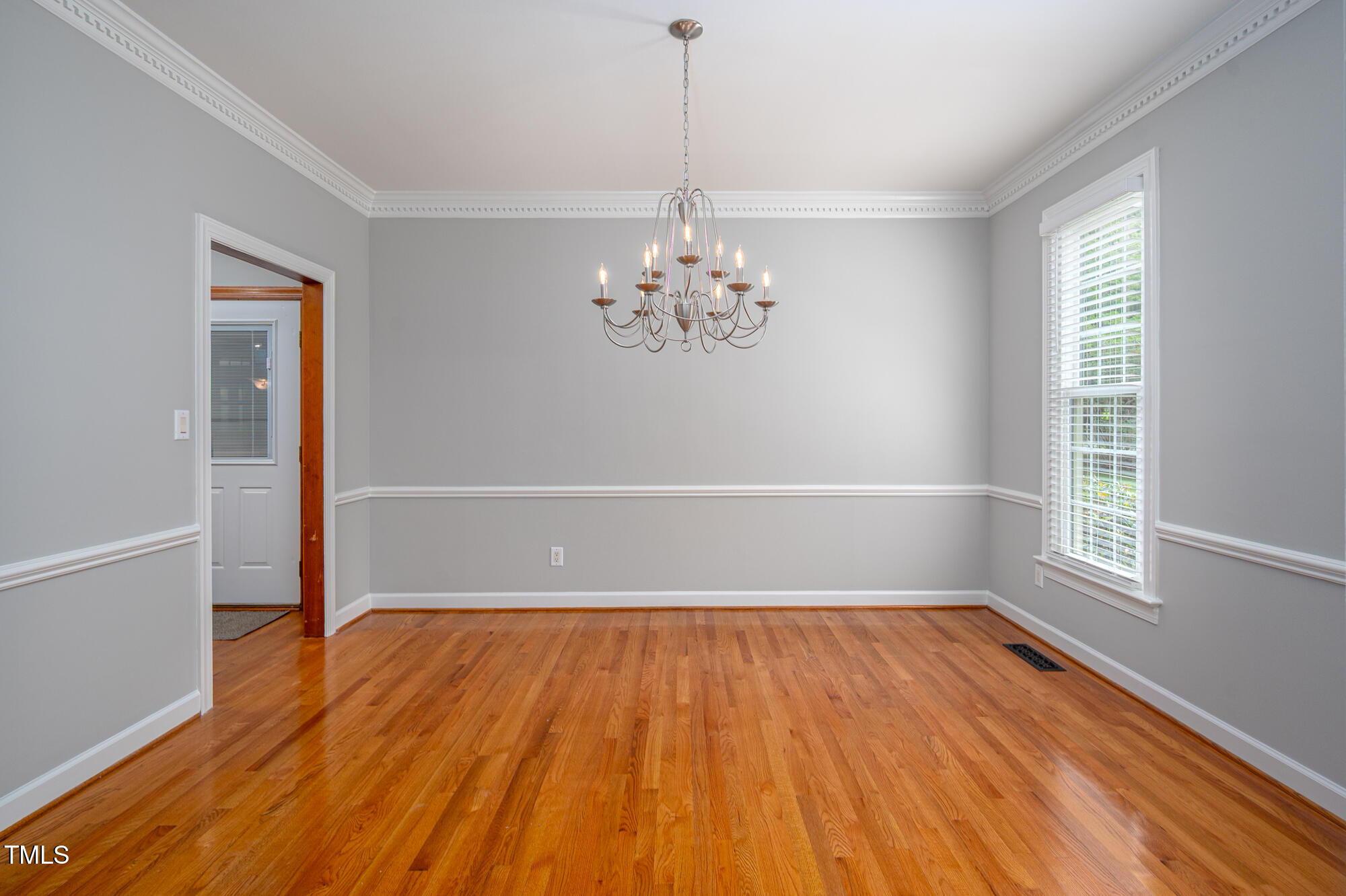 5611 Red Coach Road Durham, NC 27712 - Photo 18 of 51 a view of empty room with wooden floor and fan