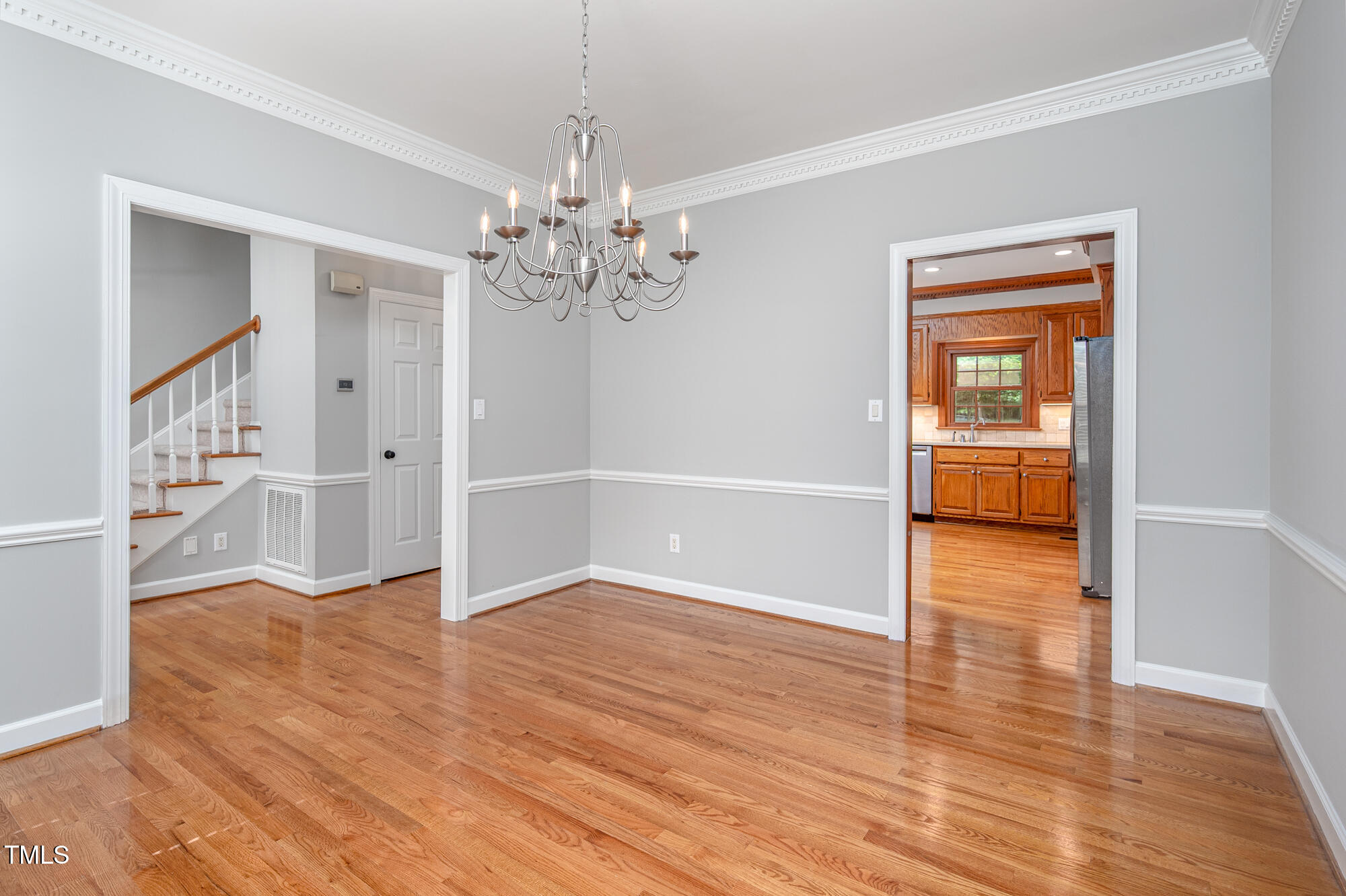 5611 Red Coach Road Durham, NC 27712 - Photo 19 of 51 wooden floor in an empty room with a window