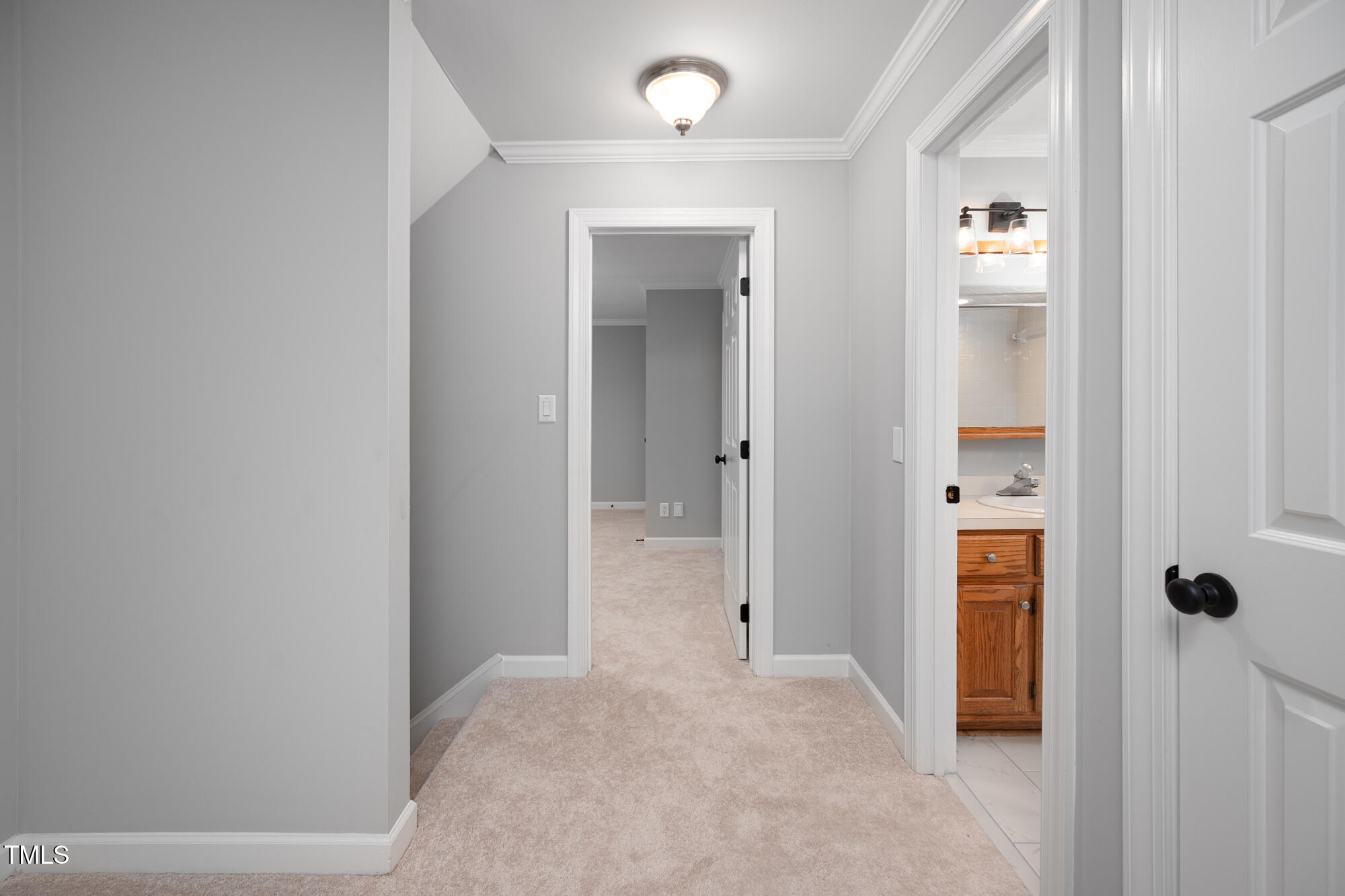 5611 Red Coach Road Durham, NC 27712 - Photo 21 of 51 a view of a hallway with wooden floor and closet