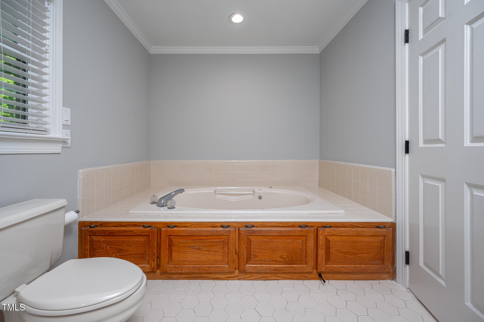 5611 Red Coach Road Durham, NC 27712 - Photo 26 of 51 a bathroom with a granite countertop sink and a toilet