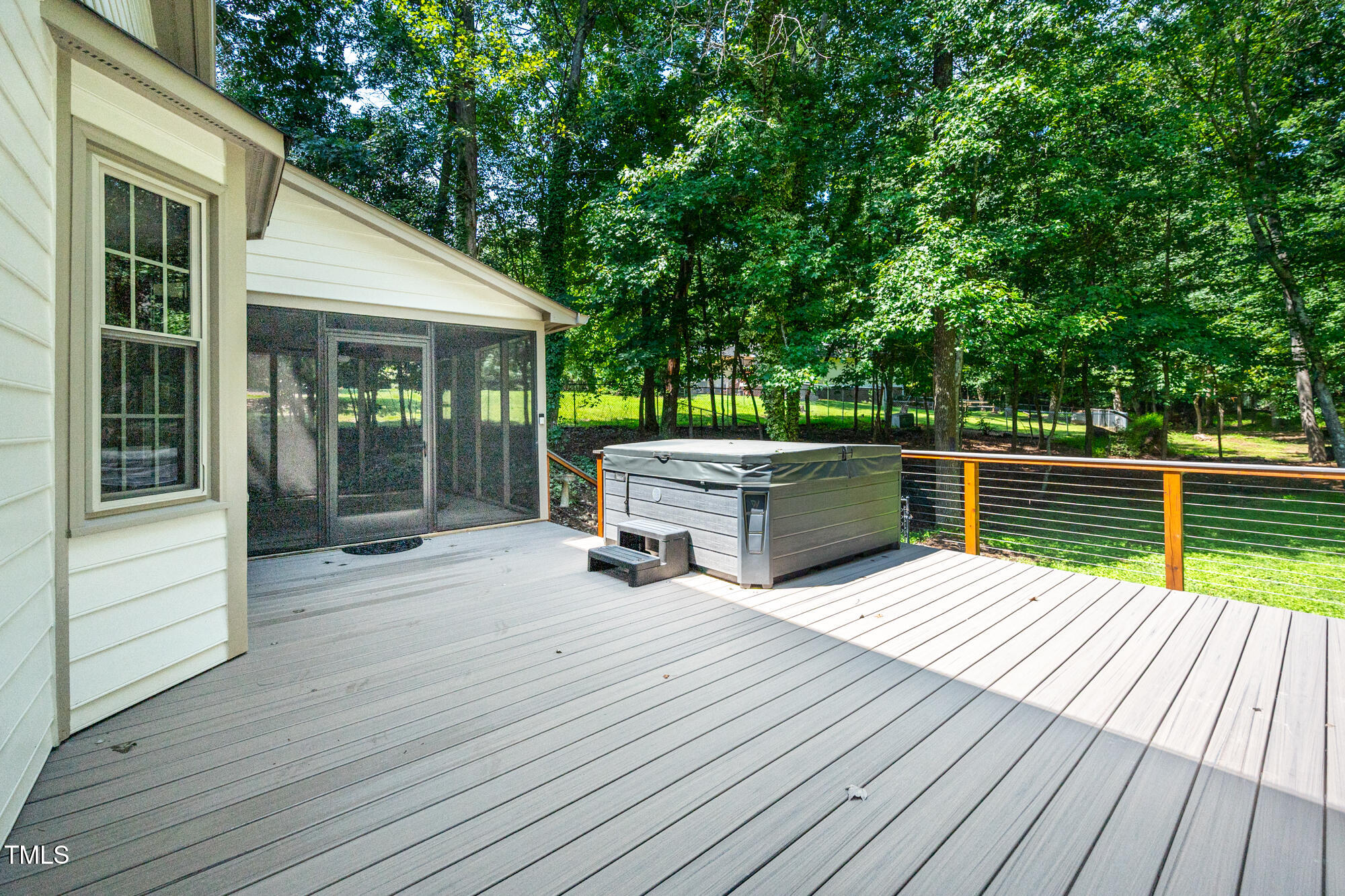 5611 Red Coach Road Durham, NC 27712 - Photo 38 of 51 a view of a deck with table and chairs and wooden floor