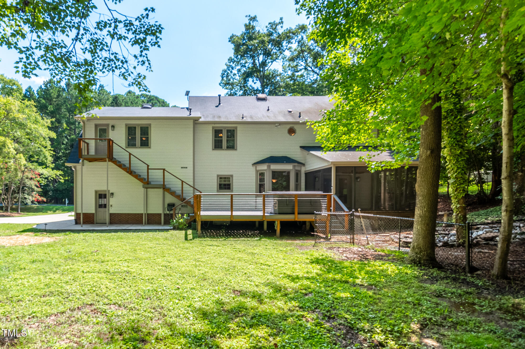 5611 Red Coach Road Durham, NC 27712 - Photo 40 of 51 a view of a house with a yard porch and sitting area