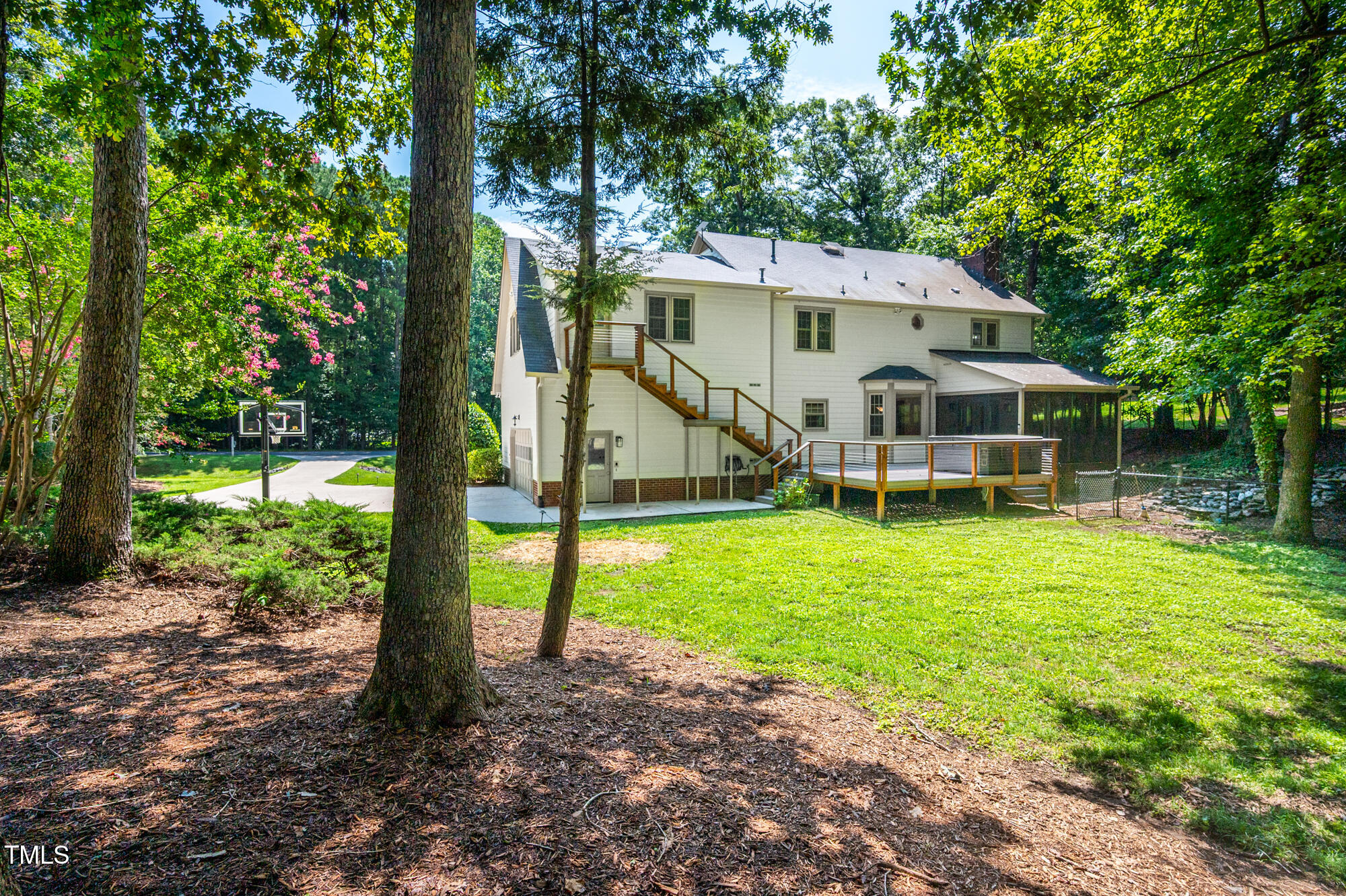 5611 Red Coach Road Durham, NC 27712 - Photo 41 of 51 a view of a house with a backyard and a patio