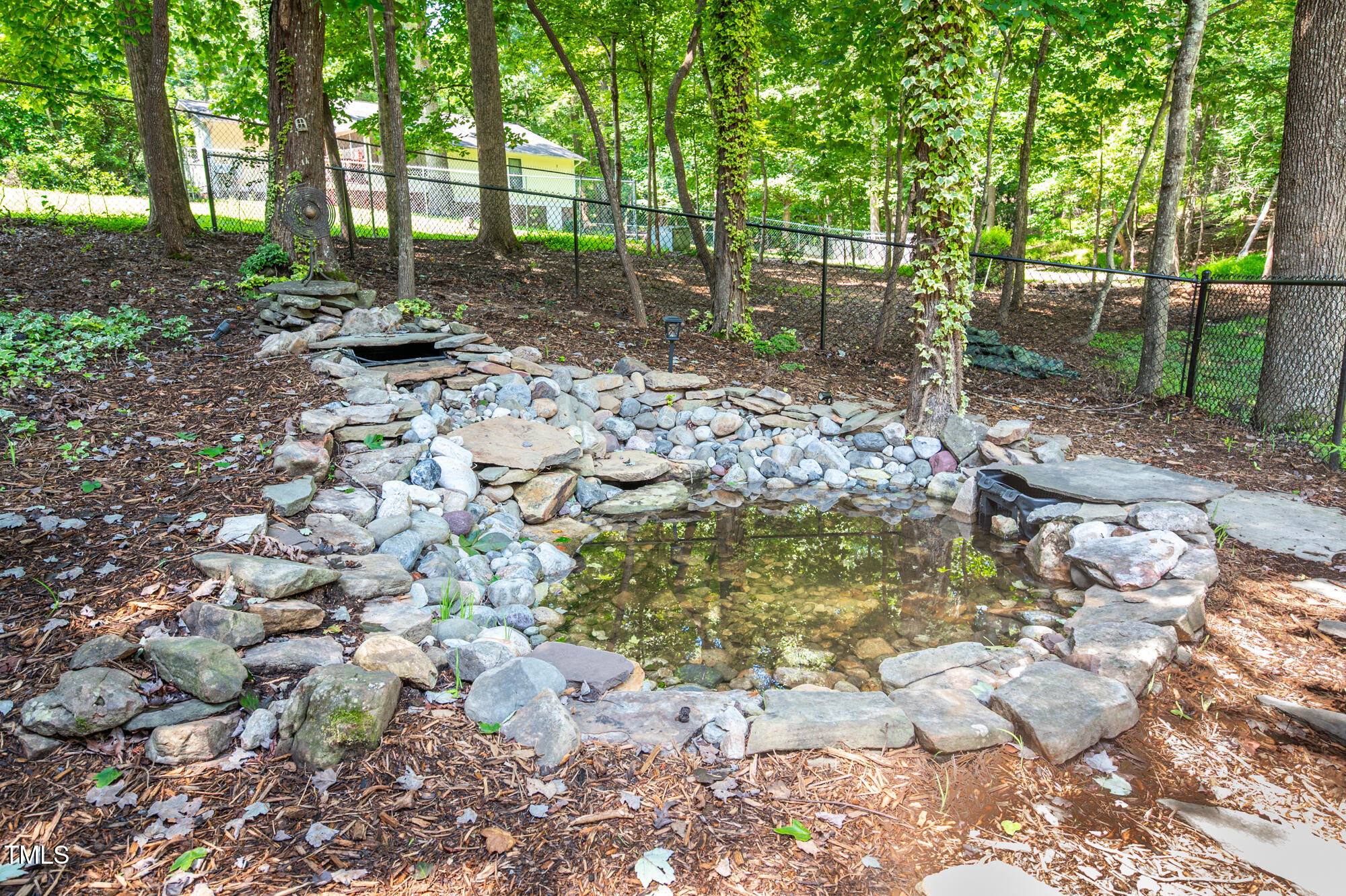 5611 Red Coach Road Durham, NC 27712 - Photo 50 of 51 a backyard of a house with lots of green space
