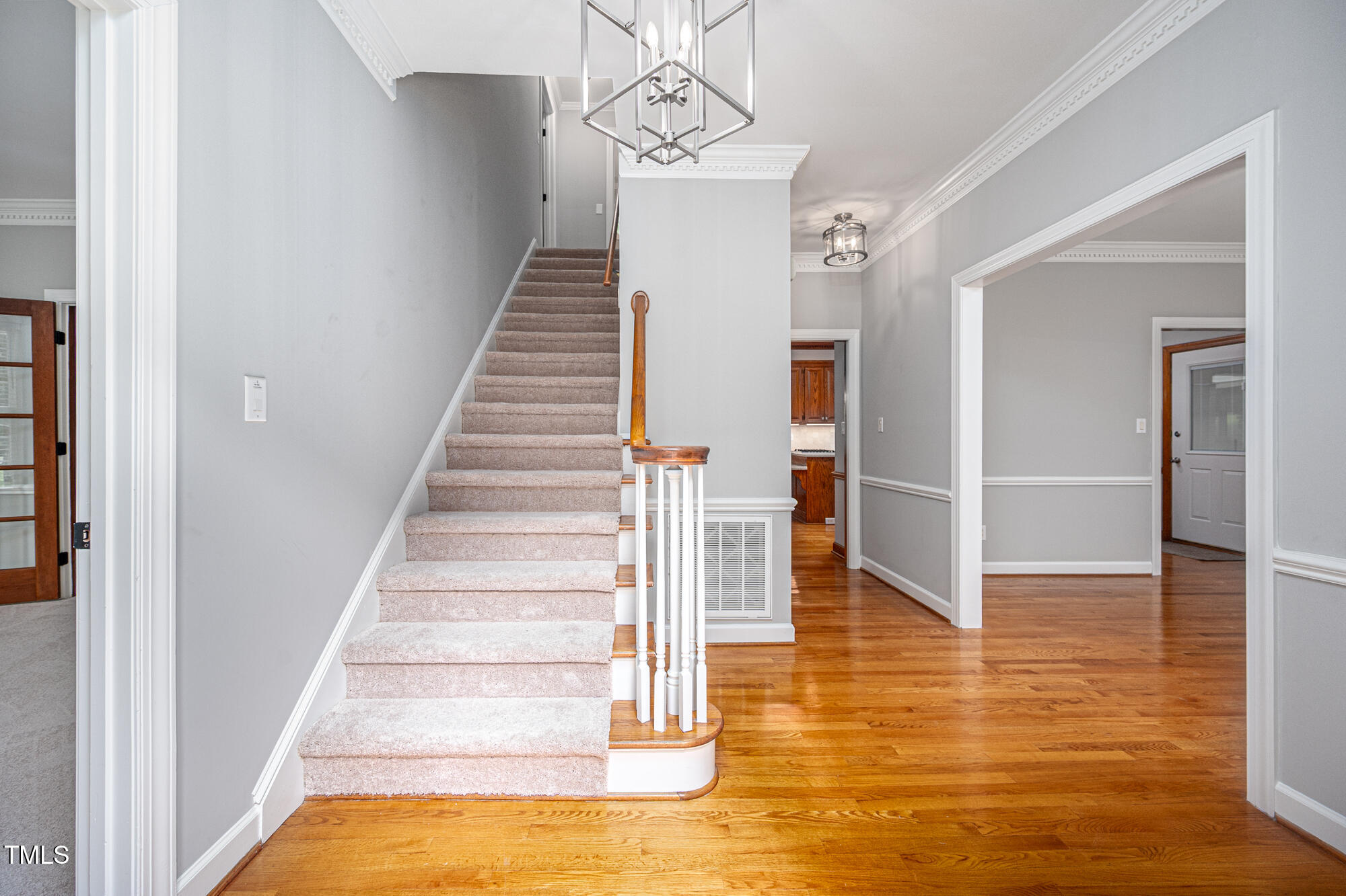 5611 Red Coach Road Durham, NC 27712 - Photo 5 of 51 a view of entryway and hall with wooden floor