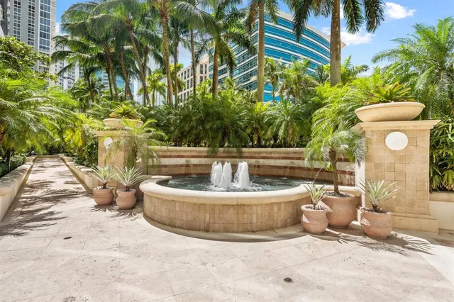 swimming pool view with a seating space and a garden view