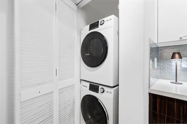 a utility room with dryer and washer