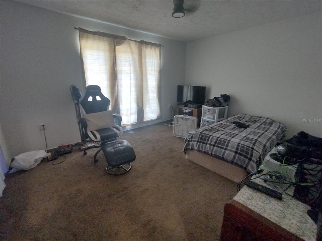 2419 Appian Avenue Spring Hill, FL 34608 - Photo 13 of 21 a bedroom with bed and a window