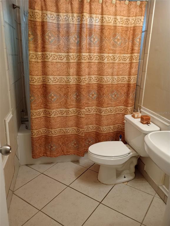 2419 Appian Avenue Spring Hill, FL 34608 - Photo 14 of 21 a bathroom with a toilet and a shower