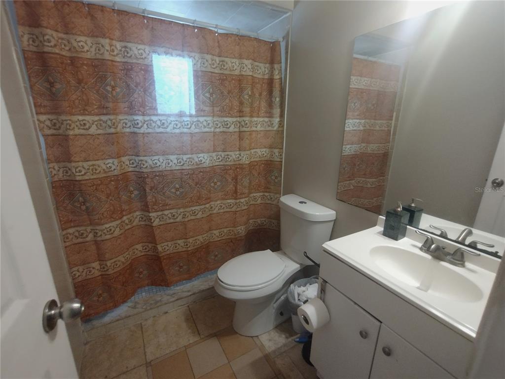 2419 Appian Avenue Spring Hill, FL 34608 - Photo 16 of 21 a bathroom with a toilet sink and shower