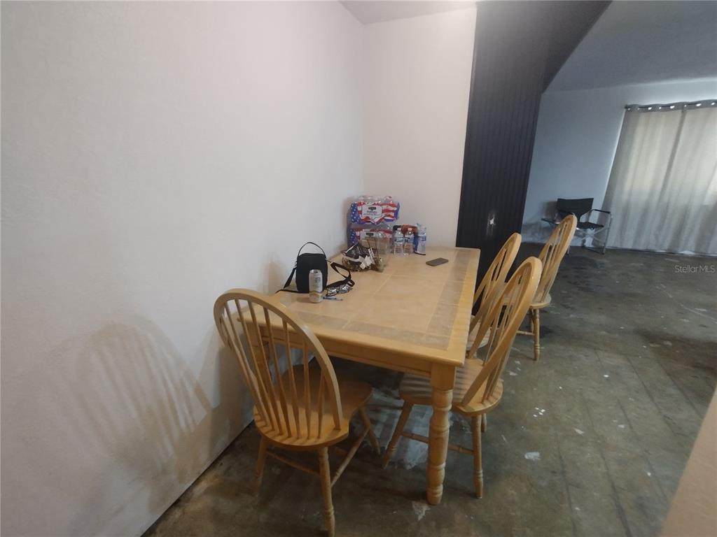 2419 Appian Avenue Spring Hill, FL 34608 - Photo 9 of 21 a view of a dining room with furniture