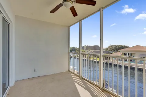 a bathroom with a toilet a sink a mirror and vanity