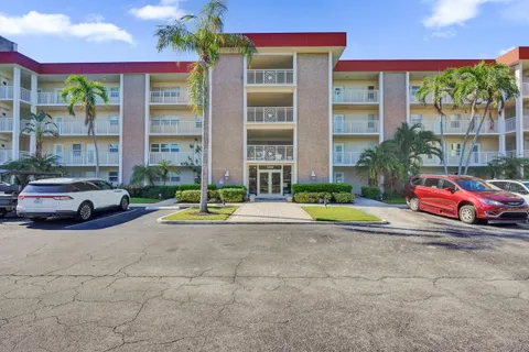 a view of a parked cars in front of a building