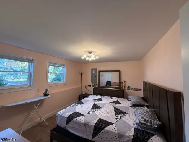 a bathroom with a shower and mirror