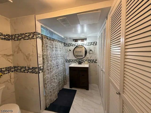 a view of a house with backyard swimming pool and sitting area