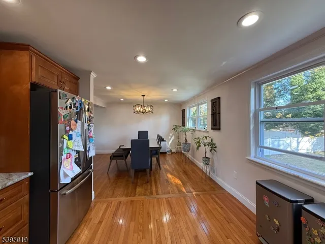 a view of a dining room with furniture window and outside view