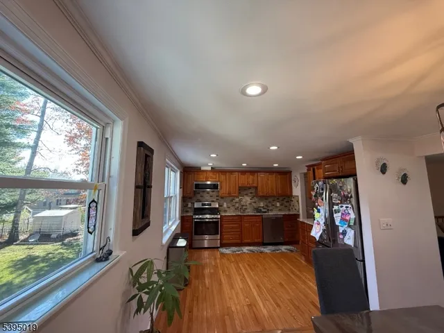 a view of a living room and a wooden floor