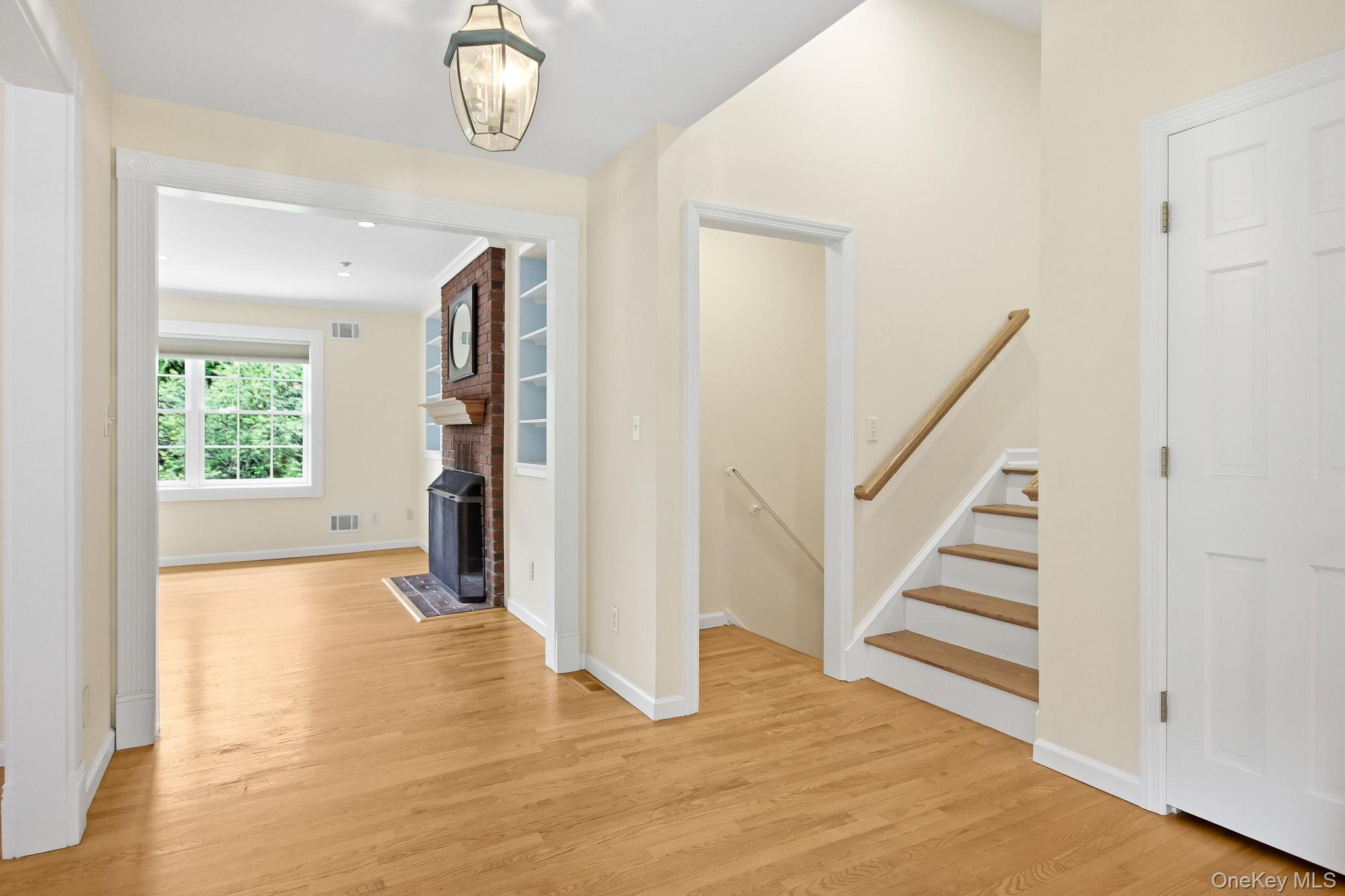 26 Century Ridge Road Purchase, NY 10577 - Photo 5 of 50 Entrance foyer featuring hardwood flooring leading to dining room and living room