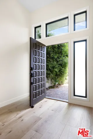 a view of entryway with wooden floor