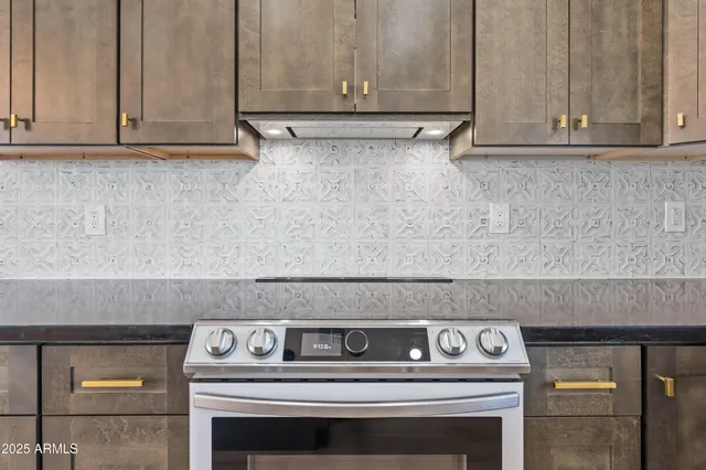 a kitchen with a sink and a wooden floor