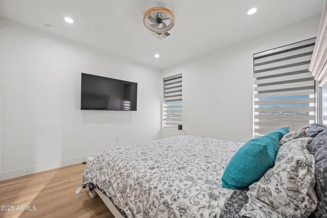 a bedroom with a bed and a window