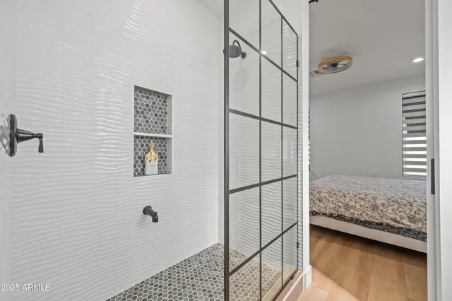 a bathroom with a toilet a sink and shower