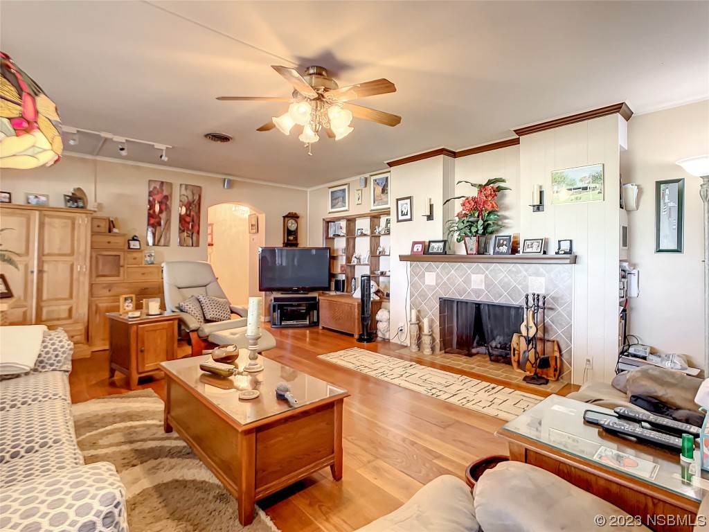 418 North Riverside Drive Edgewater, FL 32132 - Photo 12 of 48 a living room with furniture and a fireplace