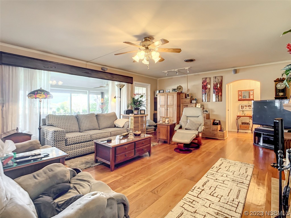 418 North Riverside Drive Edgewater, FL 32132 - Photo 13 of 48 a living room with furniture and wooden floor