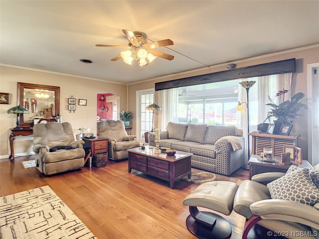 418 North Riverside Drive Edgewater, FL 32132 - Photo 14 of 48 a living room with furniture or couch and a large window