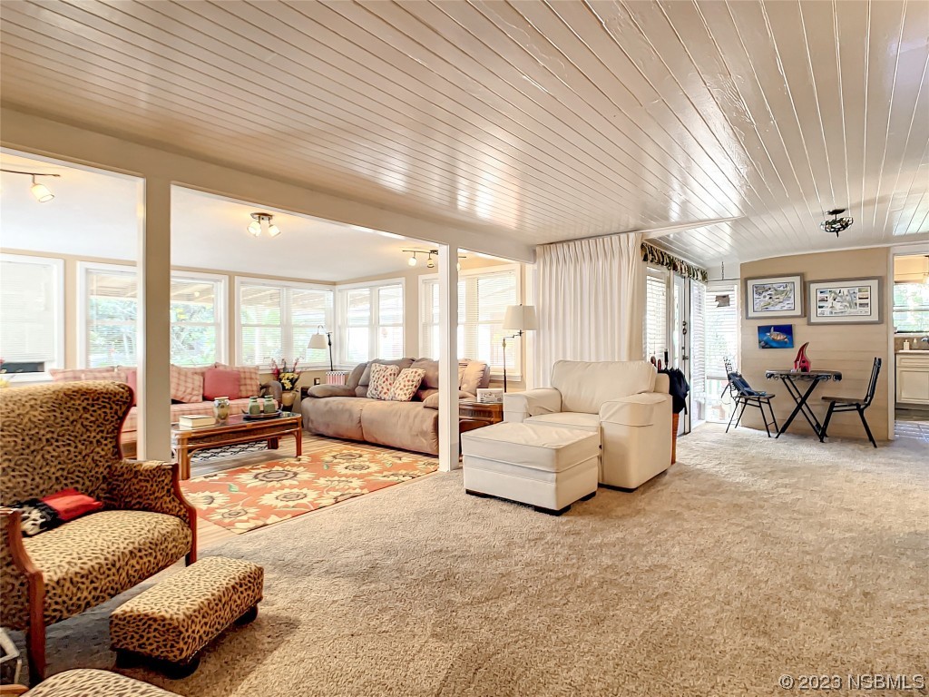 418 North Riverside Drive Edgewater, FL 32132 - Photo 23 of 48 a living room with furniture and a large window