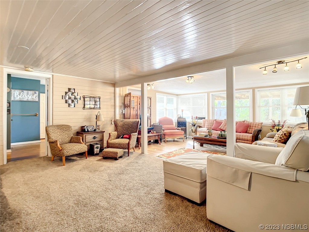 418 North Riverside Drive Edgewater, FL 32132 - Photo 24 of 48 a living room with furniture and a large window