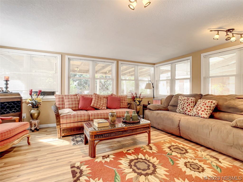 418 North Riverside Drive Edgewater, FL 32132 - Photo 25 of 48 a living room with furniture and a large window