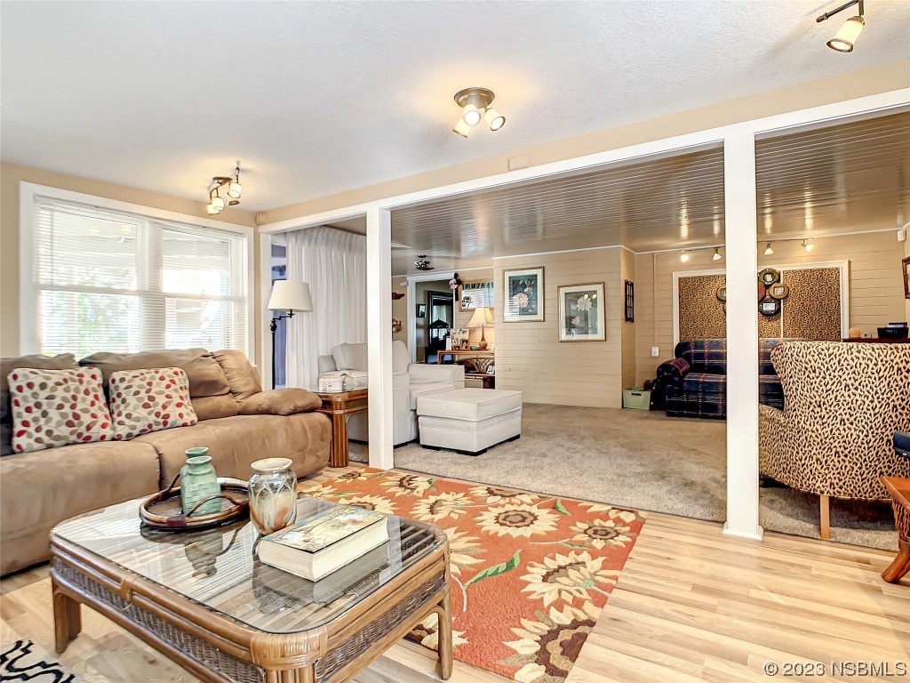 418 North Riverside Drive Edgewater, FL 32132 - Photo 27 of 48 a living room with furniture and wooden floor