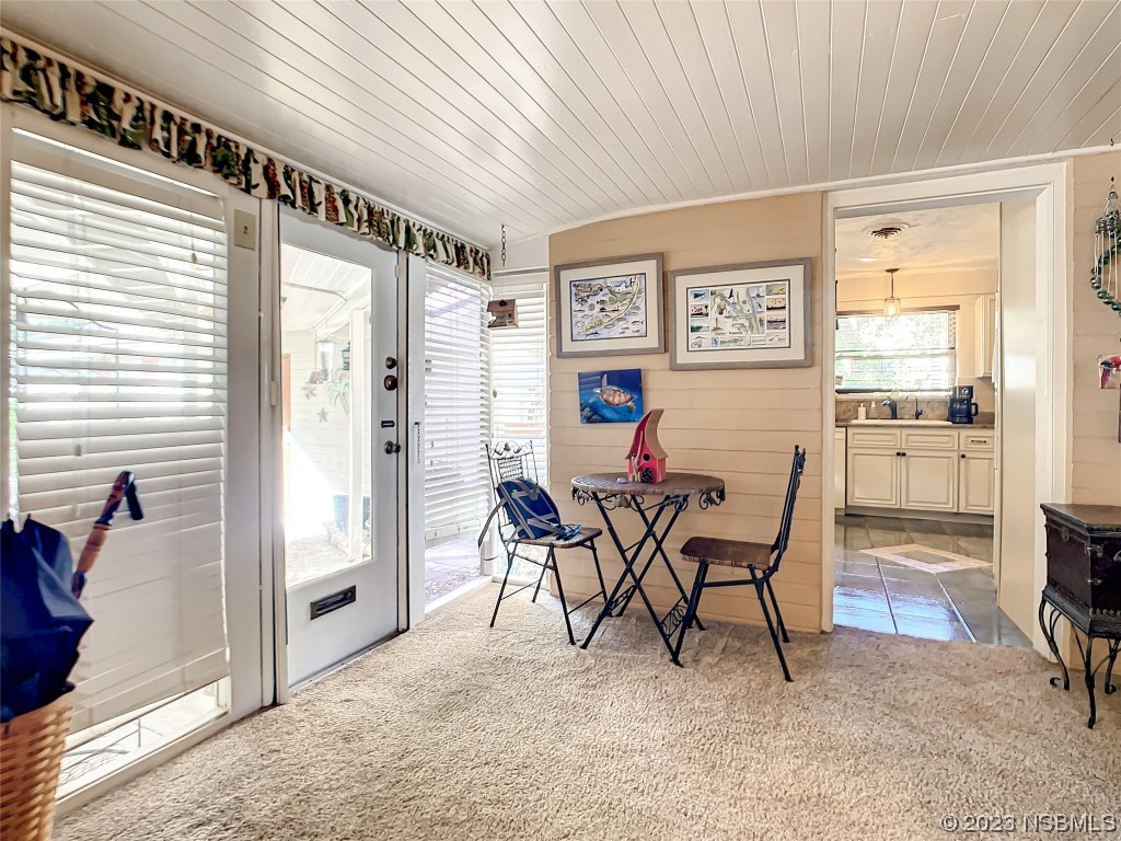 418 North Riverside Drive Edgewater, FL 32132 - Photo 29 of 48 a view of a dining room with furniture and a window