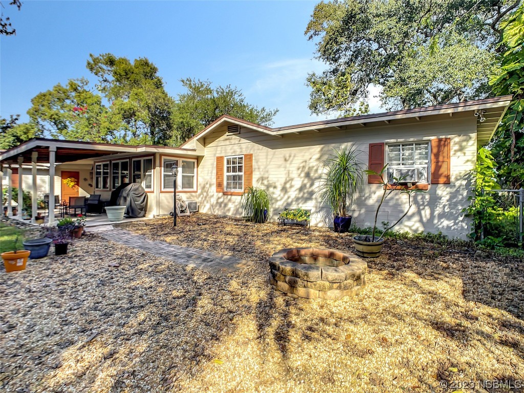 418 North Riverside Drive Edgewater, FL 32132 - Photo 43 of 48 a view of a house with a patio