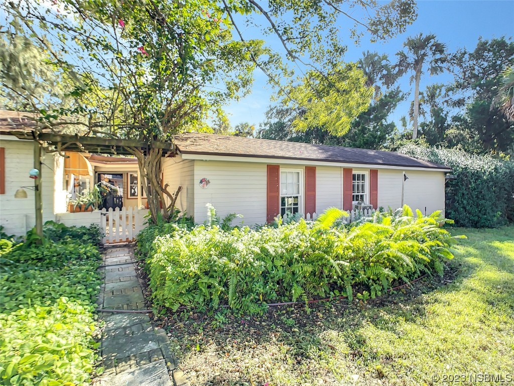 418 North Riverside Drive Edgewater, FL 32132 - Photo 46 of 48 front view of a house with a yard