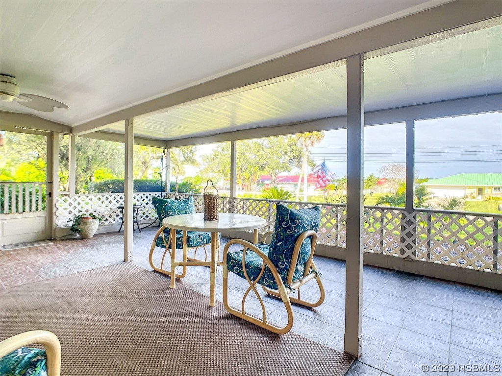418 North Riverside Drive Edgewater, FL 32132 - Photo 8 of 48 a living room with furniture and garden view