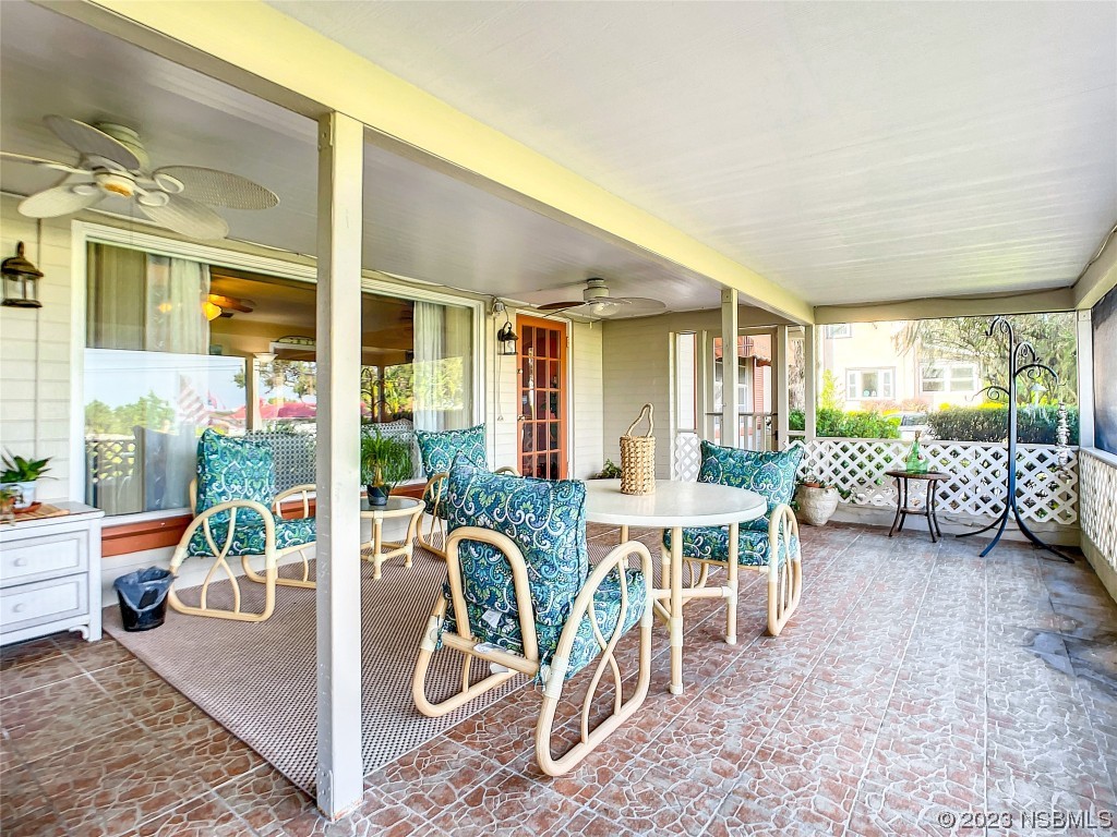418 North Riverside Drive Edgewater, FL 32132 - Photo 9 of 48 a view of a livingroom with furniture and a table